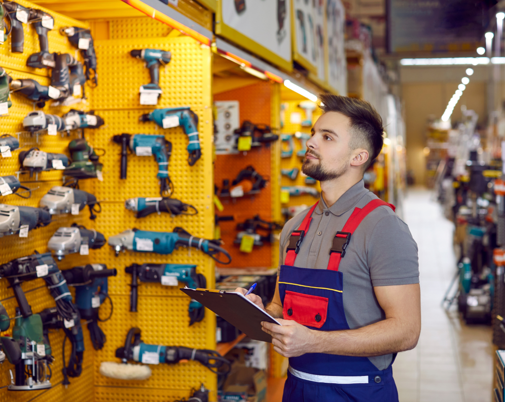 Staff checking retail shelving setup in-store