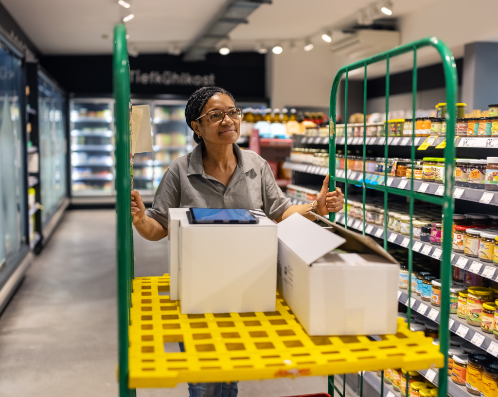 Staff restocking shelves in a grocery store